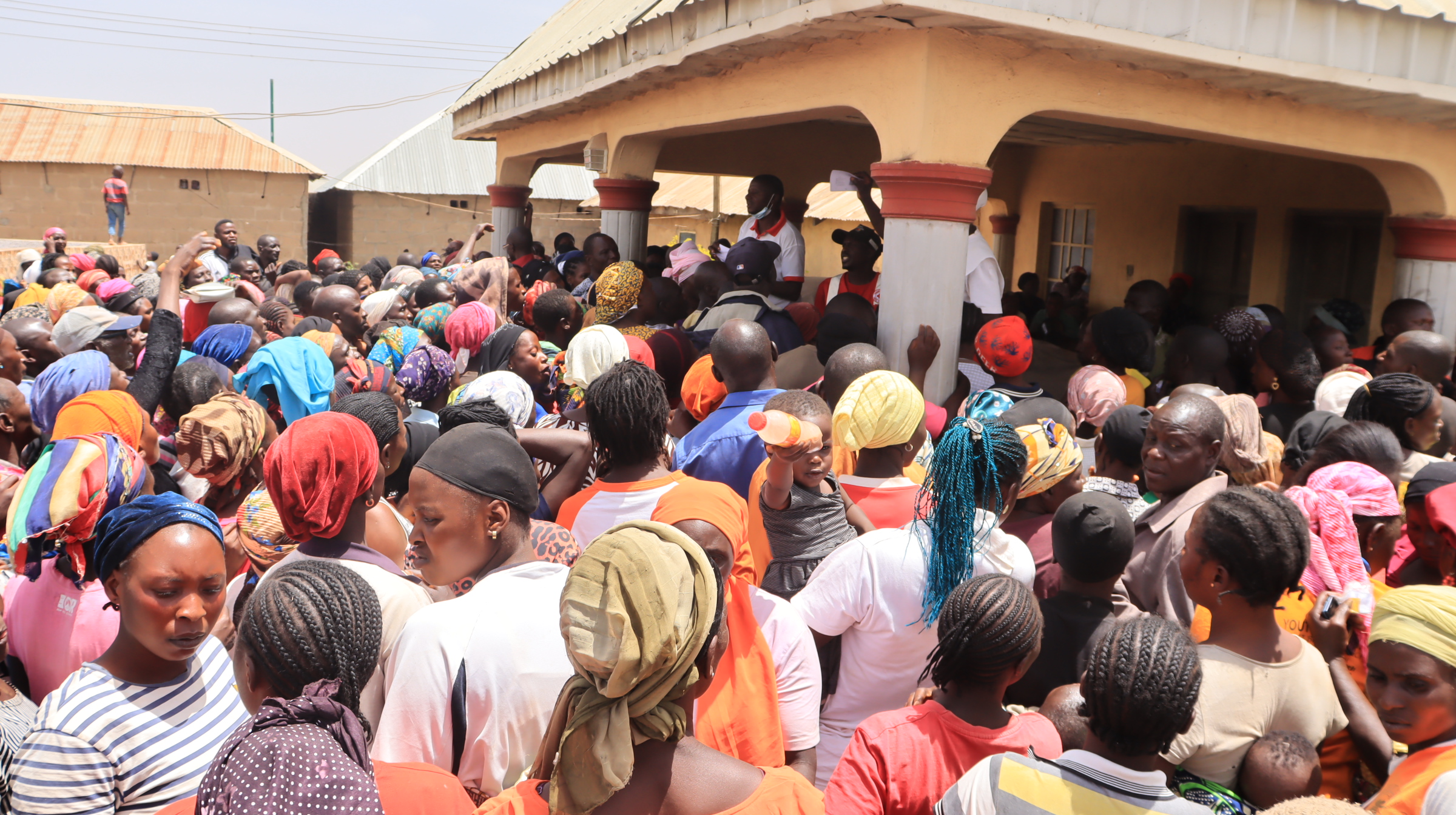 Beneficiaries struggle to hear their names called out to receive aid-  Photo Credit-Chima Nwankwo