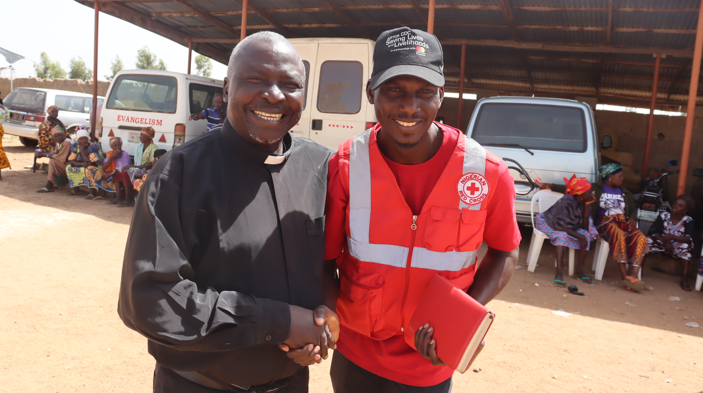 A visibly delighted Reverend Nehemiah and Dauda Mohammed, NRCS Cash Focal Point at the Barkin Ladi LGA, Nigeria distribution point- Photo Credit-Chima Nwankwo